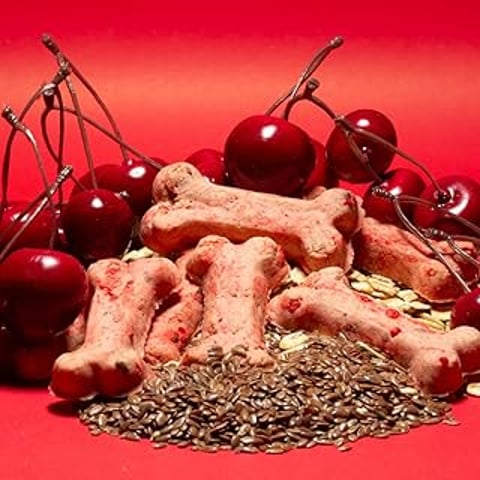 A pile of cherries and dog biscuits.