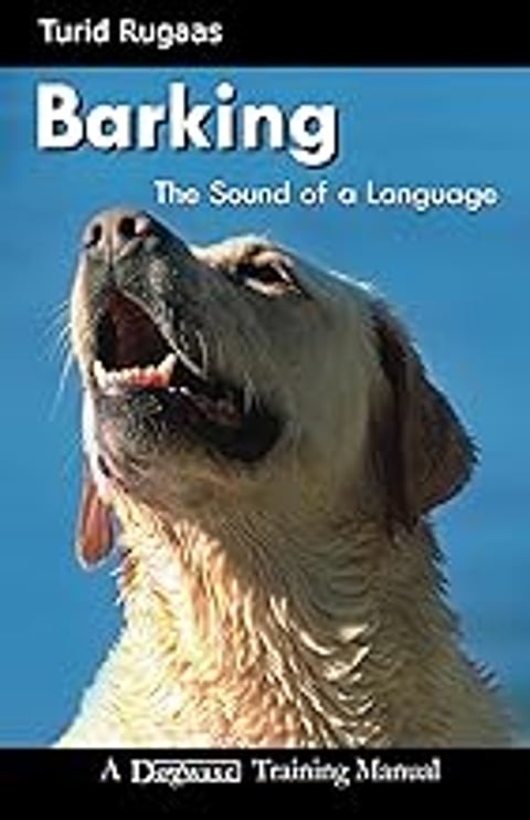 A dog with its mouth open barking.