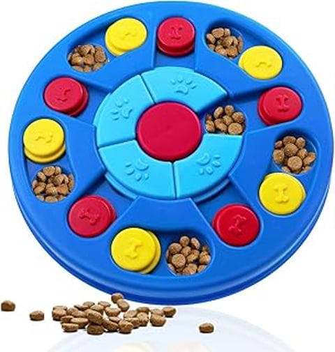 A blue and yellow dog puzzle toy with a red center.