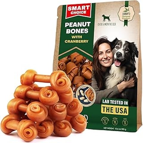 A bag of dog treats with a picture of a woman holding a dog.