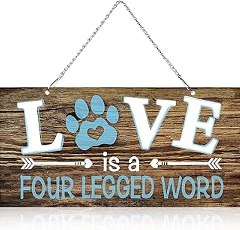 A wooden sign that says "love is a four legged word".