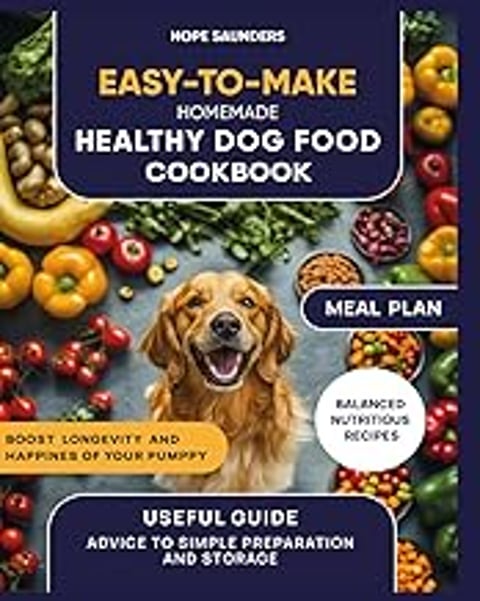A dog is smiling in front of a cookbook.