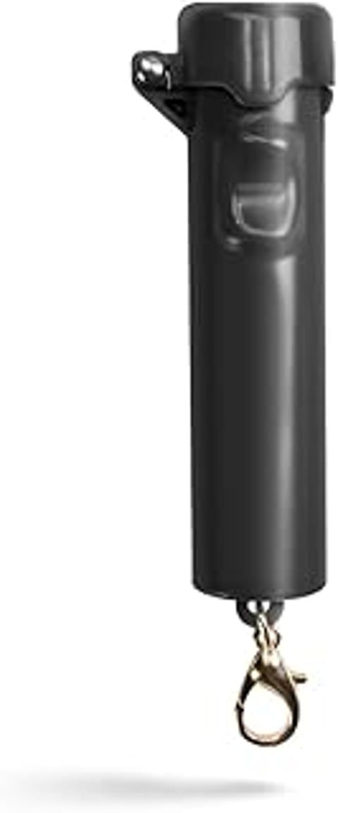A black canister of pepper spray.