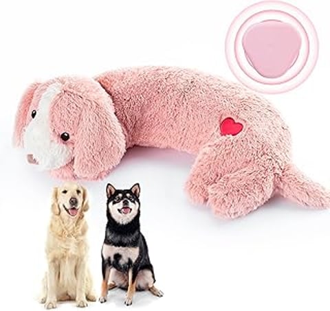 A stuffed dog with a heartbeat toy and a black dog.