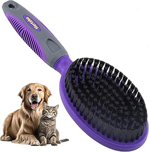 A purple brush with dense bristles for dogs and cats.
