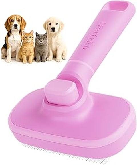 A pink Hertzko brush for grooming cats and dogs.