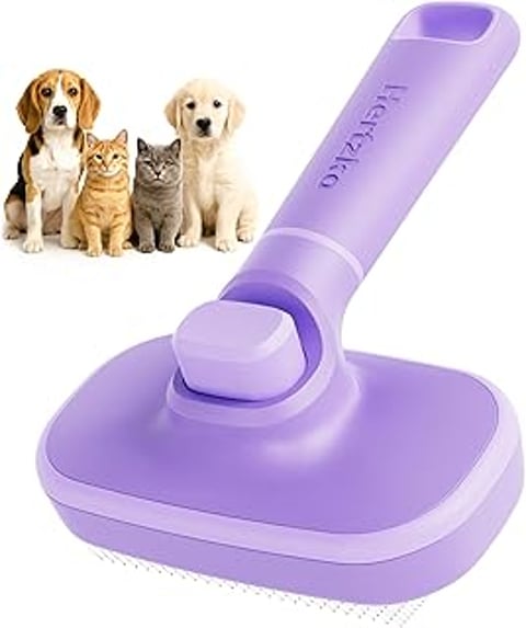 A purple brush with a cat and a dog on it.