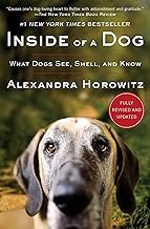 A dog's face is shown with the caption "Inside of a Dog: What Dogs See, Smell, and Know.