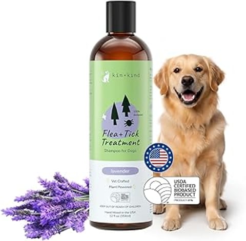 A bottle of kin+kind dog shampoo with a picture of a dog on the label.
