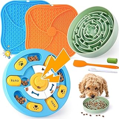 A dog toy set with a dog eating from a bowl.