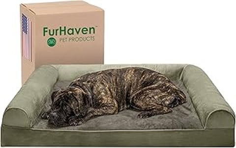 A large dog is laying on a faux fur dog bed.