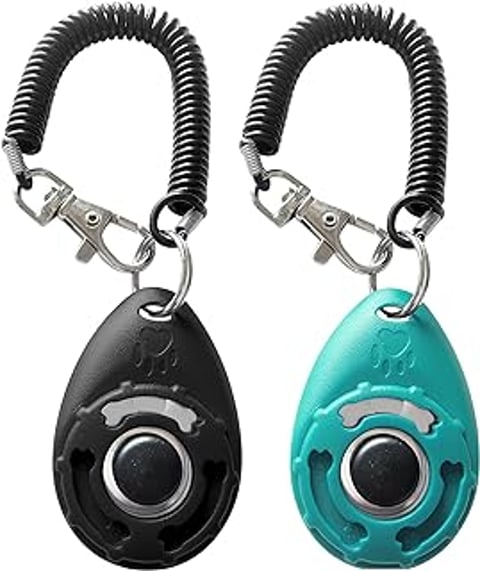 Two pet training clickers with wrist straps.