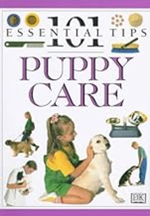A girl is holding a puppy.
