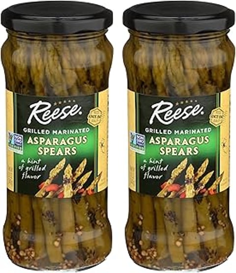 Two jars of Reese grilled marinated asparagus spears.
