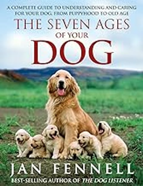 A dog with puppies in front of it.