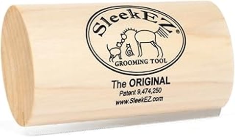 A wooden brush for grooming dogs.