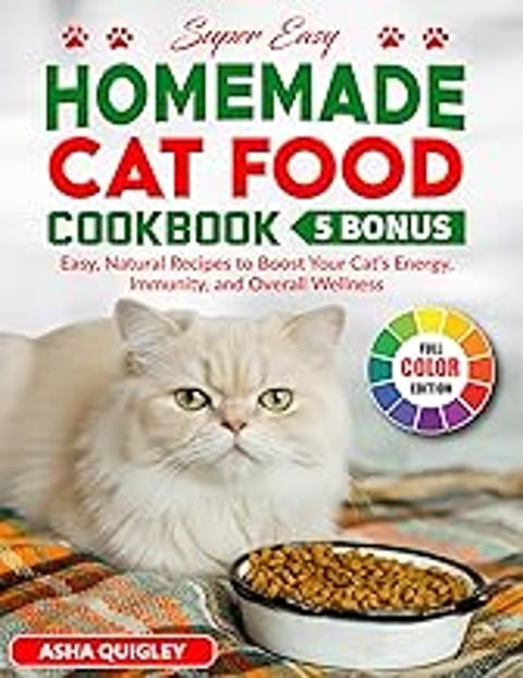 A cat food cookbook is displayed with a cat in the foreground.