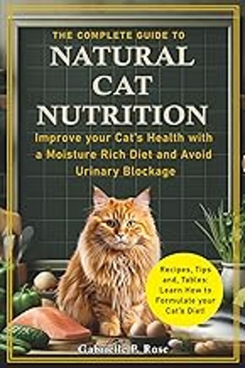 A cat is sitting on a table with a book about natural cat nutrition.