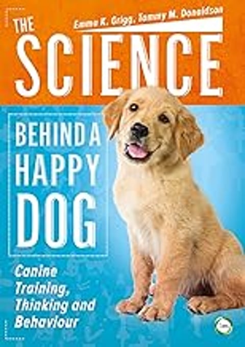 A happy dog is shown on the cover of a book.