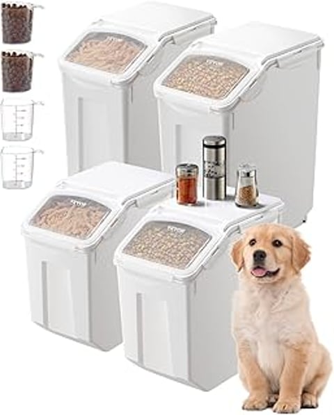 A white container with a dog standing next to it.