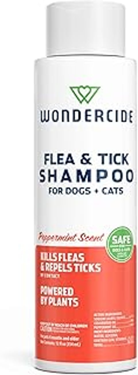 A bottle of flea and tick shampoo for dogs and cats.