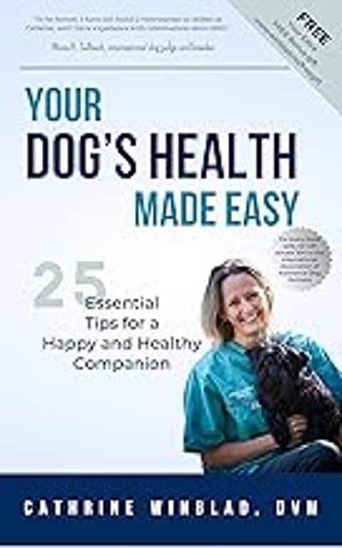 A woman holding a black dog.